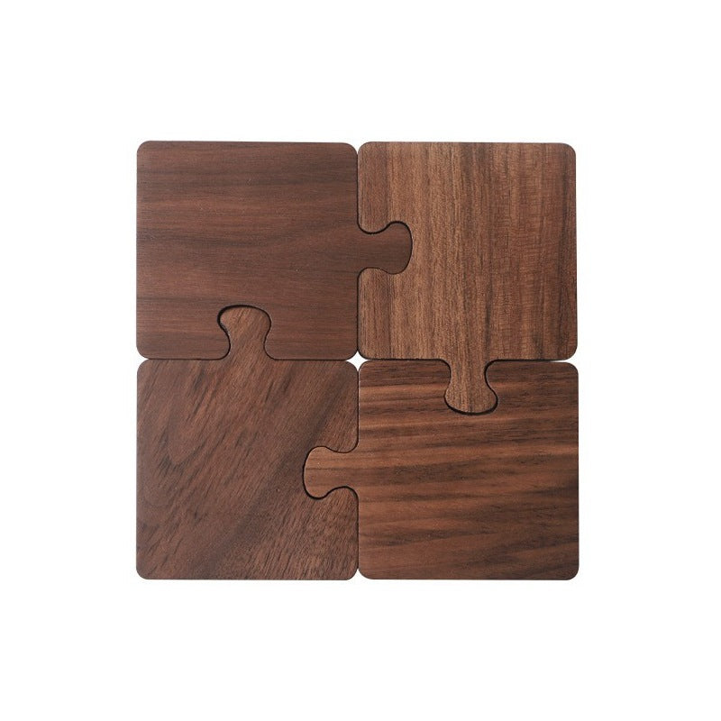 Four walnut coasters fitted together into a square